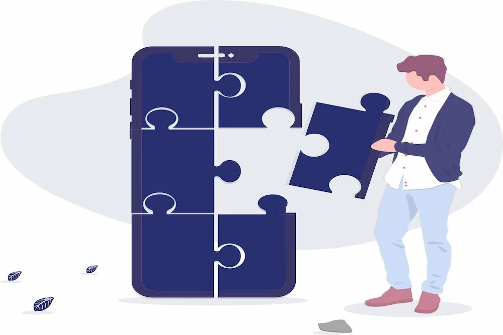 man putting puzzle pieces together to form mobile app