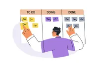 tracking tasks with sticky notes in columns labeled To Do, Doing, Done